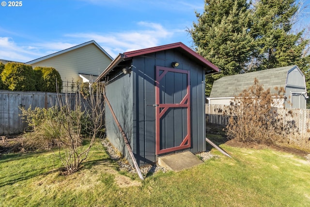 view of outbuilding with a lawn