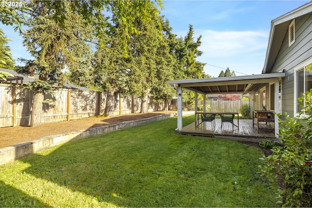 view of yard featuring a wooden deck