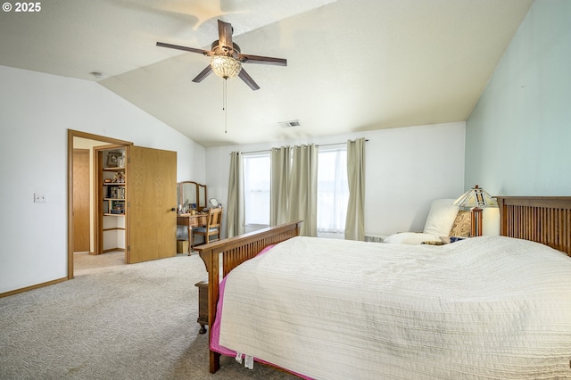 bedroom featuring baseboards, visible vents, a ceiling fan, vaulted ceiling, and carpet flooring