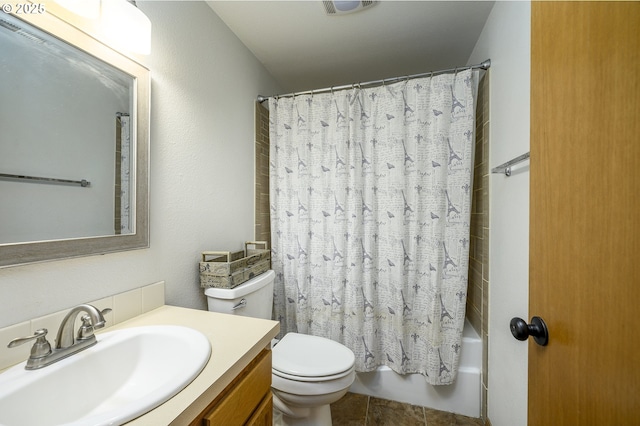 bathroom with visible vents, shower / tub combo, vanity, and toilet