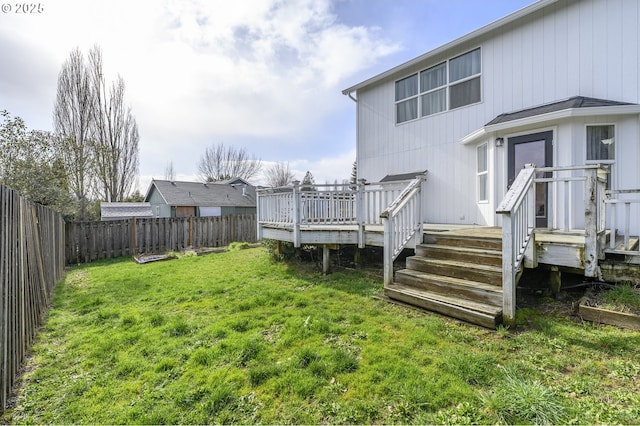 view of yard featuring a fenced backyard and a wooden deck