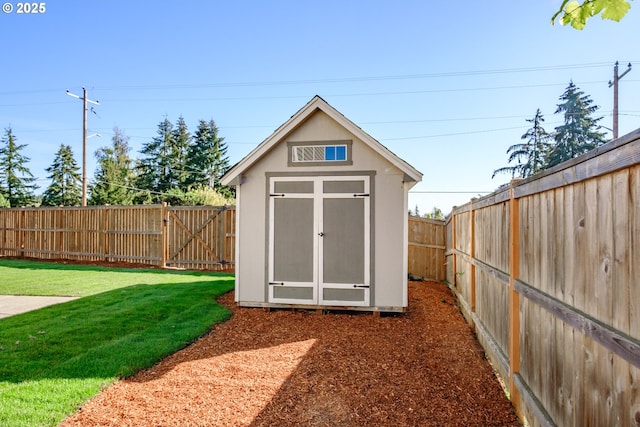 view of shed with a fenced backyard