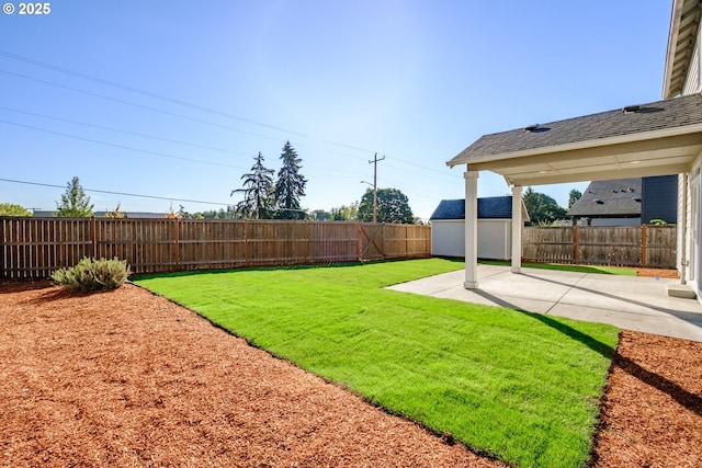 view of yard with a patio area, an outdoor structure, a fenced backyard, and a storage shed