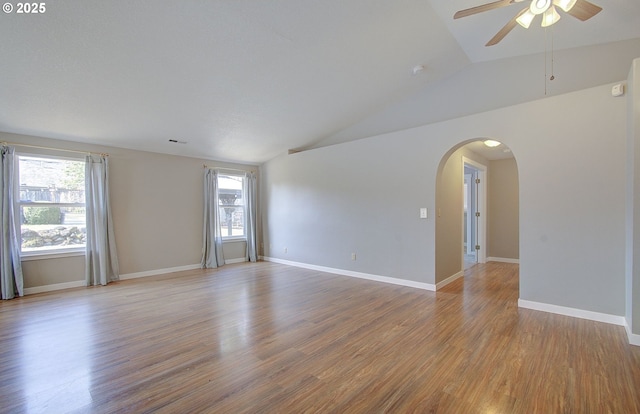 15807 NE 48th Cir, Vancouver, WA 98682 - unfurnished room featuring a ceiling fan, lofted ceiling, wood finished floors, and arched walkways