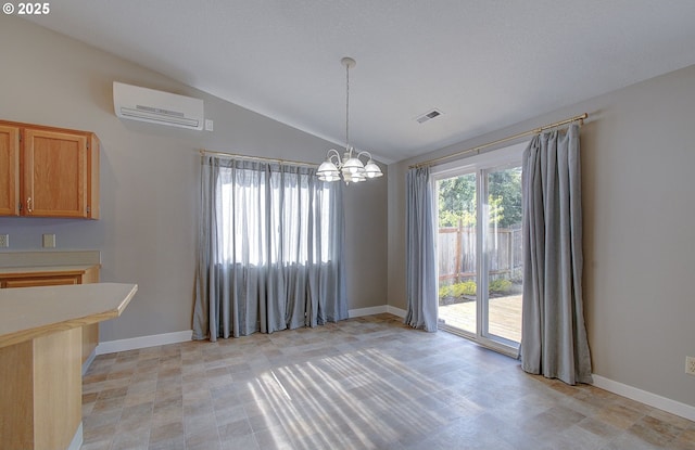 15807 NE 48th Cir, Vancouver, WA 98682 - unfurnished dining area featuring a wall mounted AC, vaulted ceiling, and a chandelier