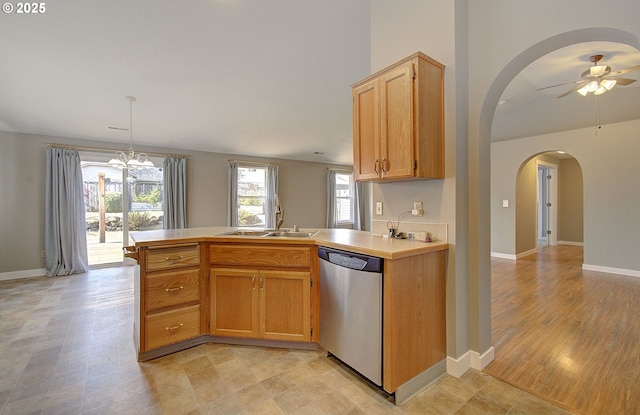 15807 NE 48th Cir, Vancouver, WA 98682 - kitchen featuring stainless steel dishwasher, arched walkways, a peninsula, a ceiling fan, and light countertops