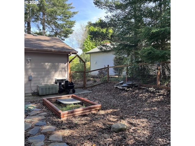 view of yard with fence and cooling unit