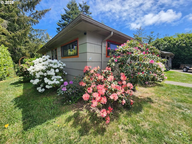 view of home's exterior featuring a lawn