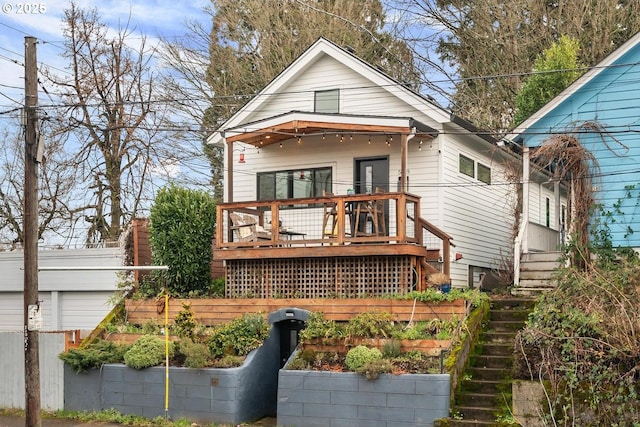 back of house featuring a deck