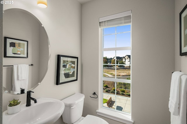 bathroom with sink and toilet