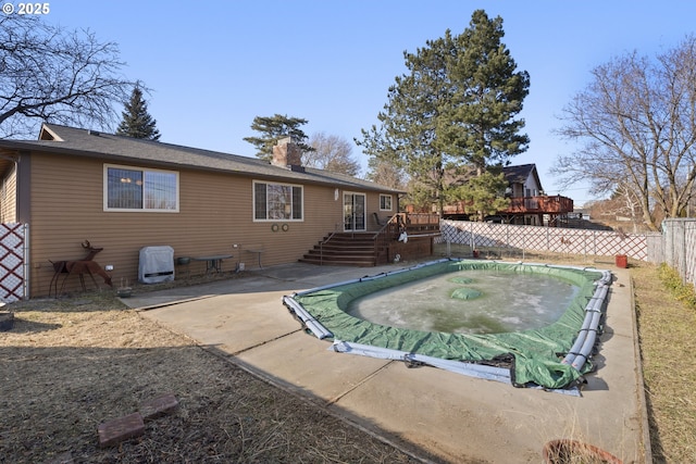 back of property featuring a deck