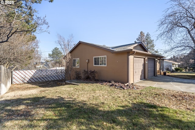 view of home's exterior with a garage and a lawn