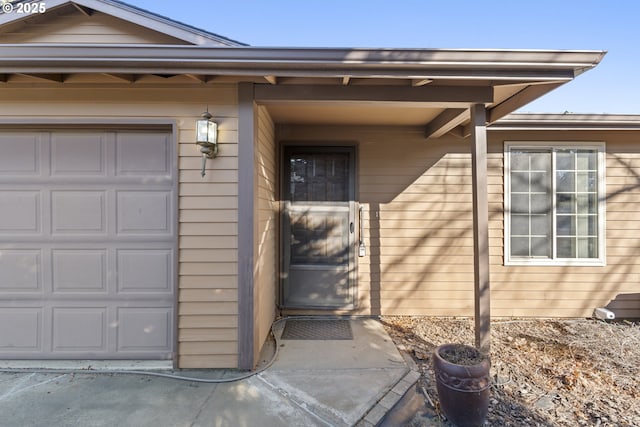 property entrance with a garage