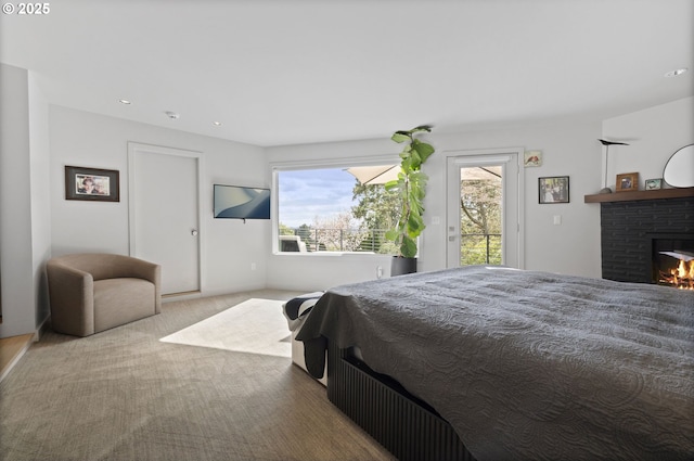3701 SW 38th Ave, Portland, OR 97221 - bedroom with carpet, access to exterior, a fireplace, and recessed lighting