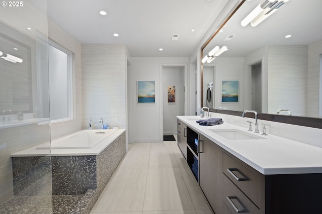3701 SW 38th Ave, Portland, OR 97221 - full bath with double vanity, a garden tub, tile patterned floors, recessed lighting, and washer / clothes dryer