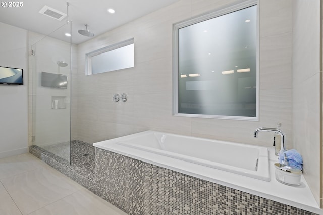 3701 SW 38th Ave, Portland, OR 97221 - bathroom with a bath, a tile shower, and tile patterned flooring