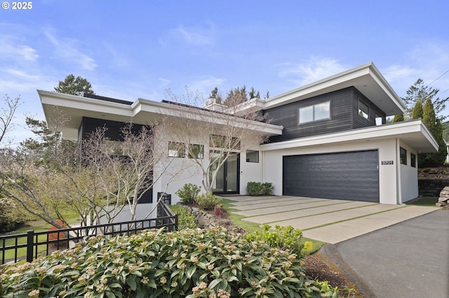 3701 SW 38th Ave, Portland, OR 97221 - contemporary home featuring stucco siding, driveway, and an attached garage