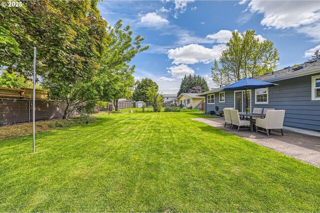 view of yard with a fenced backyard and a patio area