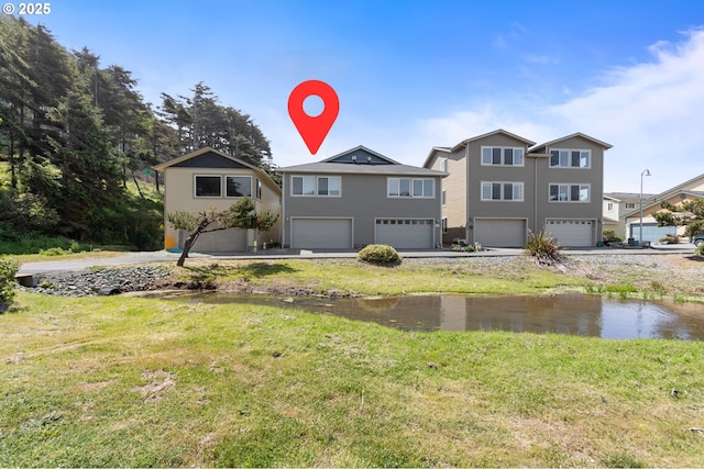 29027 Vizcaino Ct, Gold Beach, OR 97444 - view of front of property with a garage and a front yard