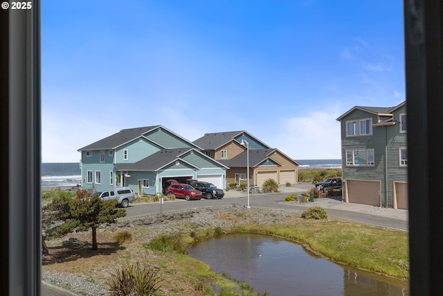 29027 Vizcaino Ct, Gold Beach, OR 97444 - view of yard featuring a water view and concrete driveway