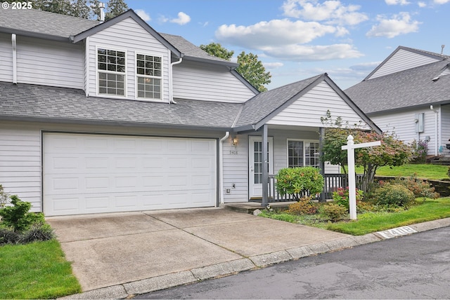 view of front of house featuring a garage and covered porch