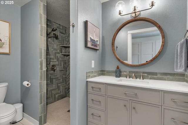 bathroom featuring vanity, a walk in shower, and toilet