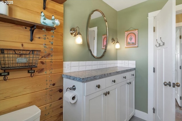 bathroom featuring toilet and vanity