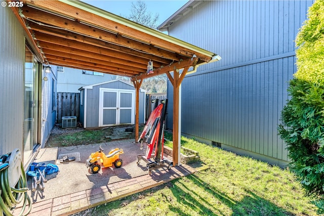 exterior space featuring central AC and a storage unit