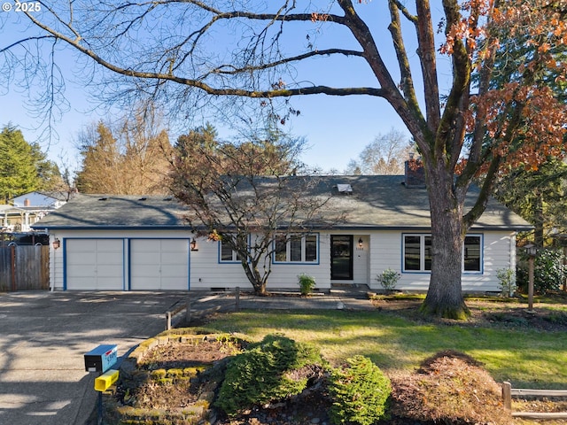 ranch-style home featuring a garage and a front yard