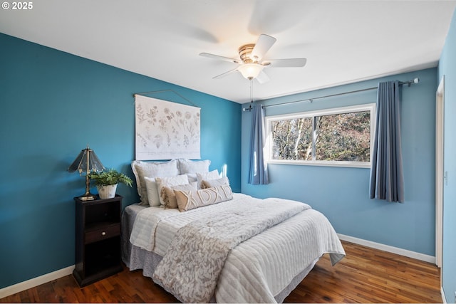 bedroom featuring dark wood-type flooring and ceiling fan