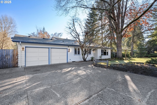 single story home featuring a garage