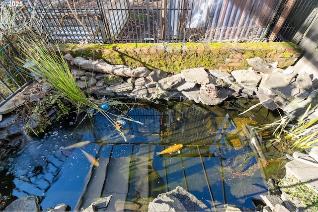 exterior details featuring a small pond