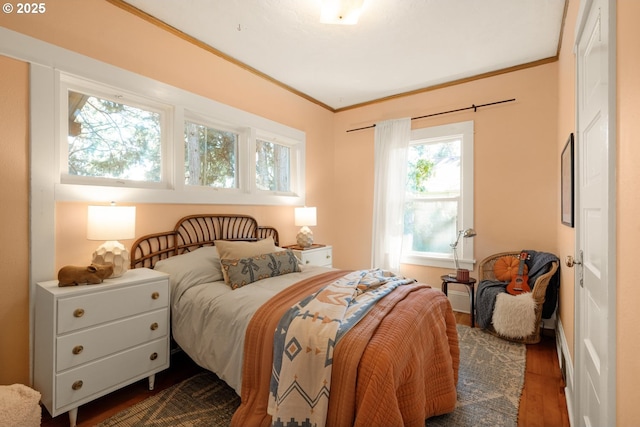 bedroom featuring dark wood-style flooring and ornamental molding