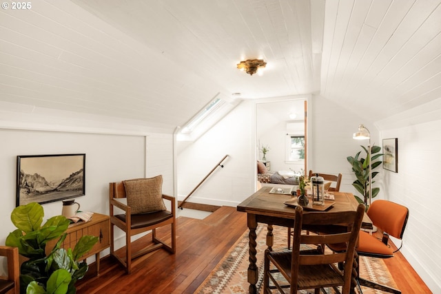 dining area with wood-type flooring, wood ceiling, and lofted ceiling
