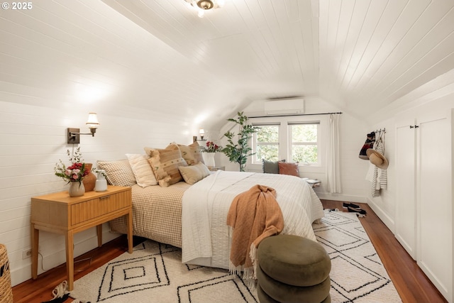 bedroom featuring wood ceiling, a wall mounted AC, vaulted ceiling, and wood finished floors