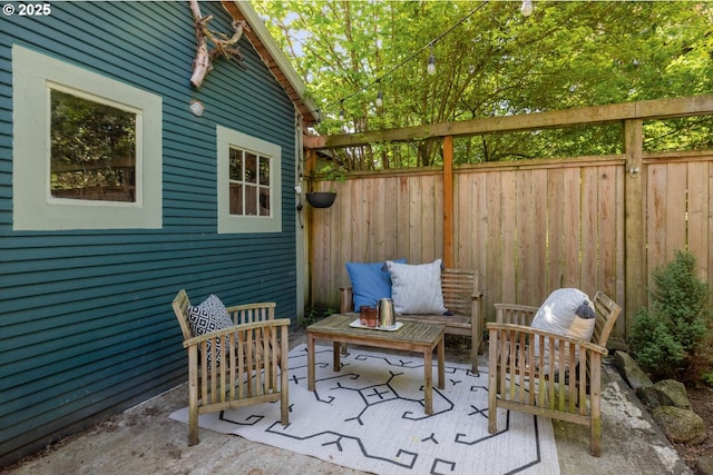 view of patio / terrace with fence and an outdoor hangout area