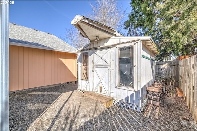 view of shed with a fenced backyard