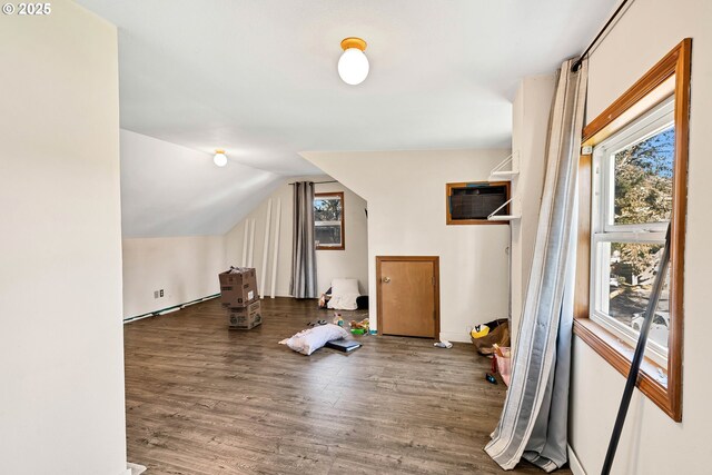 12107 SE Carlton St, Portland, OR 97266 - additional living space with a wall mounted air conditioner, lofted ceiling, and wood finished floors