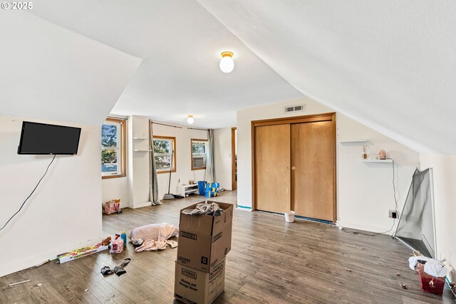12107 SE Carlton St, Portland, OR 97266 - rec room with lofted ceiling, visible vents, and wood finished floors