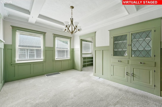 4529 SE 44th Ave, Portland, OR 97206 - carpeted spare room featuring a decorative wall, a chandelier, coffered ceiling, crown molding, and beamed ceiling