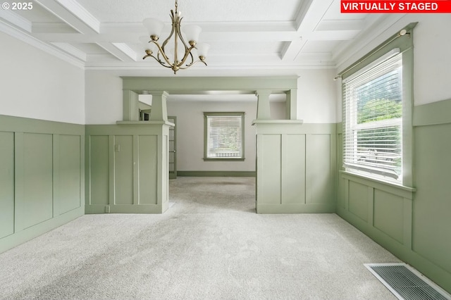 4529 SE 44th Ave, Portland, OR 97206 - unfurnished room with coffered ceiling, carpet flooring, beamed ceiling, a decorative wall, and a chandelier