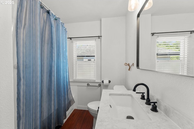 4529 SE 44th Ave, Portland, OR 97206 - full bathroom featuring wood finished floors, vanity, and a shower with shower curtain