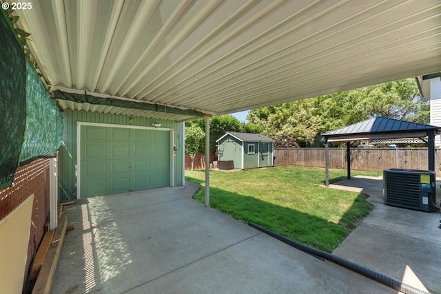 4529 SE 44th Ave, Portland, OR 97206 - fenced backyard with a gazebo, a garage, concrete driveway, and a storage shed