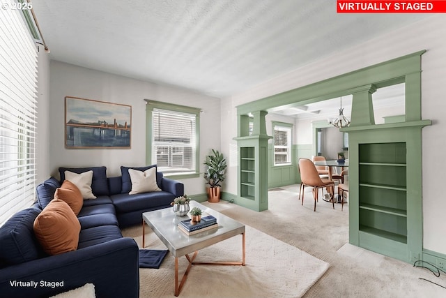 4529 SE 44th Ave, Portland, OR 97206 - carpeted living room featuring a chandelier