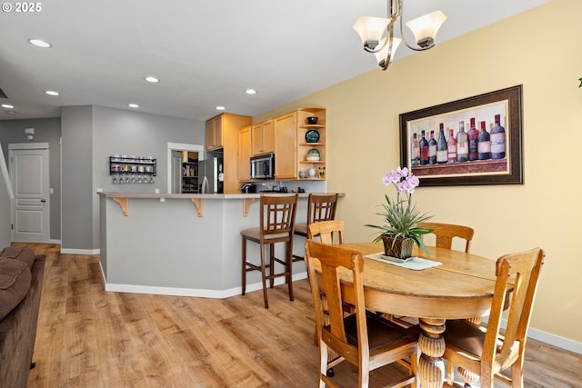 14640 SW Redbud Way, Beaverton, OR 97007 - dining space with light wood-style floors, recessed lighting, and a chandelier