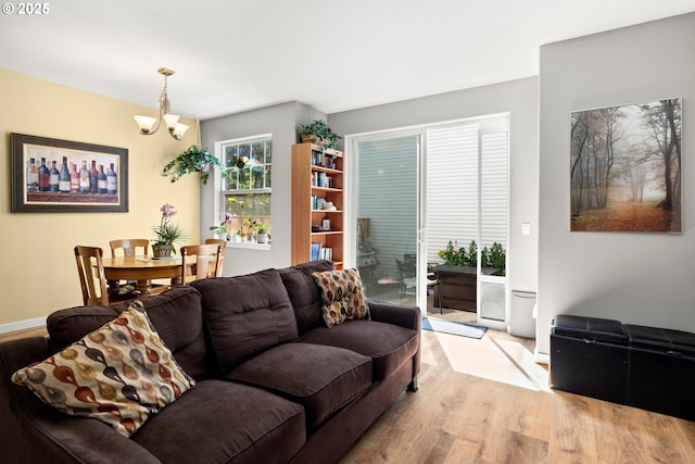14640 SW Redbud Way, Beaverton, OR 97007 - living area featuring wood finished floors and a chandelier