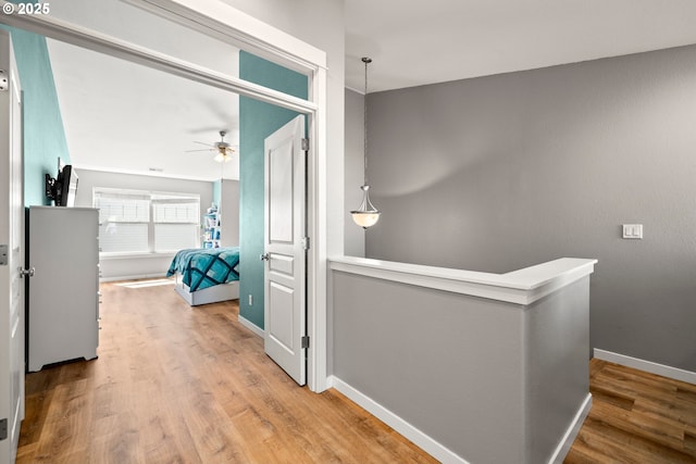 14640 SW Redbud Way, Beaverton, OR 97007 - corridor featuring an upstairs landing and wood finished floors