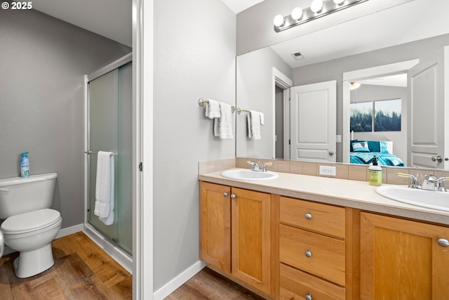 14640 SW Redbud Way, Beaverton, OR 97007 - bathroom with double vanity, wood finished floors, and a shower stall