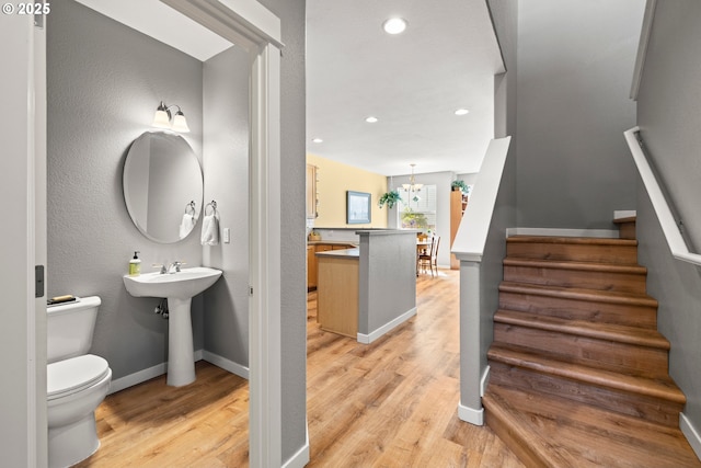 14640 SW Redbud Way, Beaverton, OR 97007 - bathroom featuring wood finished floors, recessed lighting, and a chandelier