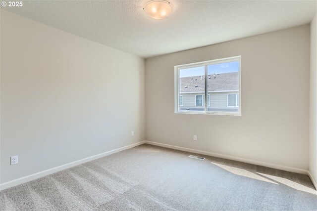 31709 NW Turel Dr, North Plains, OR 97133 - unfurnished room featuring baseboards, visible vents, carpet floors, and a textured ceiling